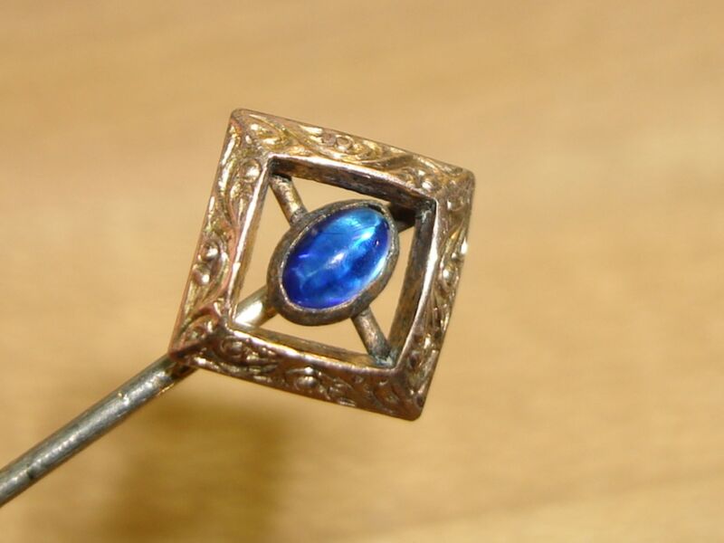 Antique Art Nouveau blue glass stick pin with gold plated silver setting
