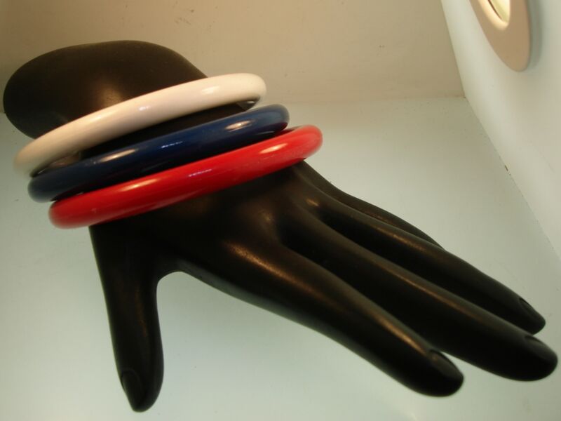 Set of three vintage patriotic red, white, and blue lucite bangle bracelets