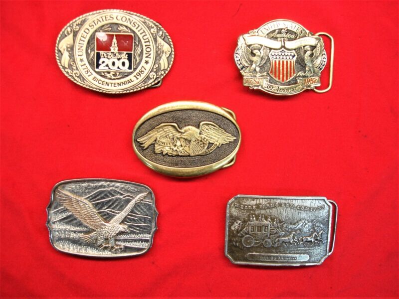 Set of 5 vintage Western belt buckles featuring Constitution, eagle, and stagecoach designs.