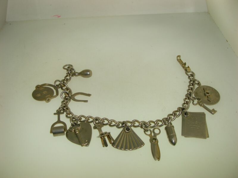 Vintage 1950s mechanical charm bracelet with movable charms