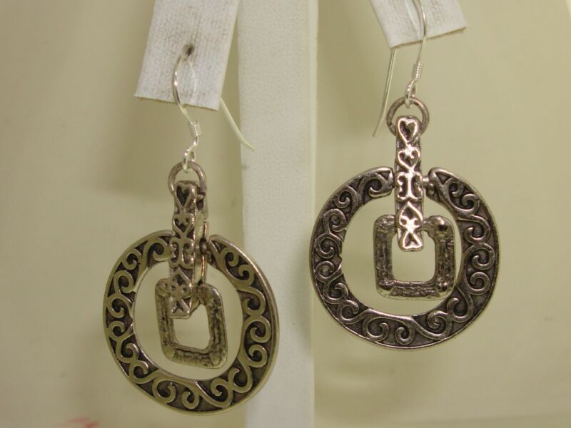 Vintage sterling silver Celtic dangle earrings with an intricate open circle design