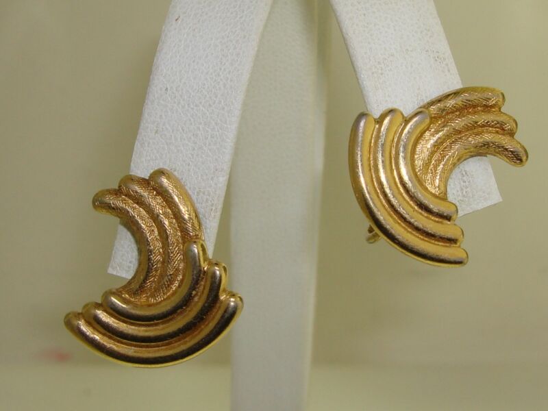 Vintage Trifari gold tone clip-on earrings with an elegant angled tube design