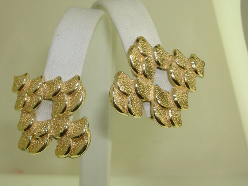 Vintage Coro textured gold-tone clip-on earrings with an elegant petal design.