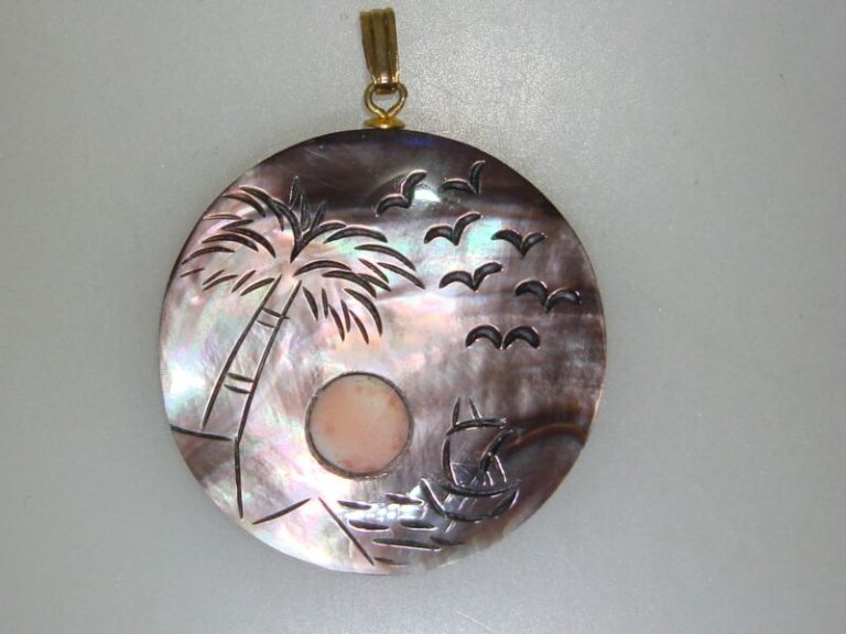 Vintage carved mother of pearl pendant with coral inlay and etched water scene