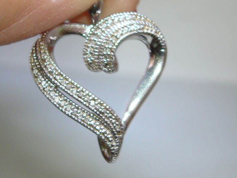 Sterling silver open heart pendant with sparkling diamond accents