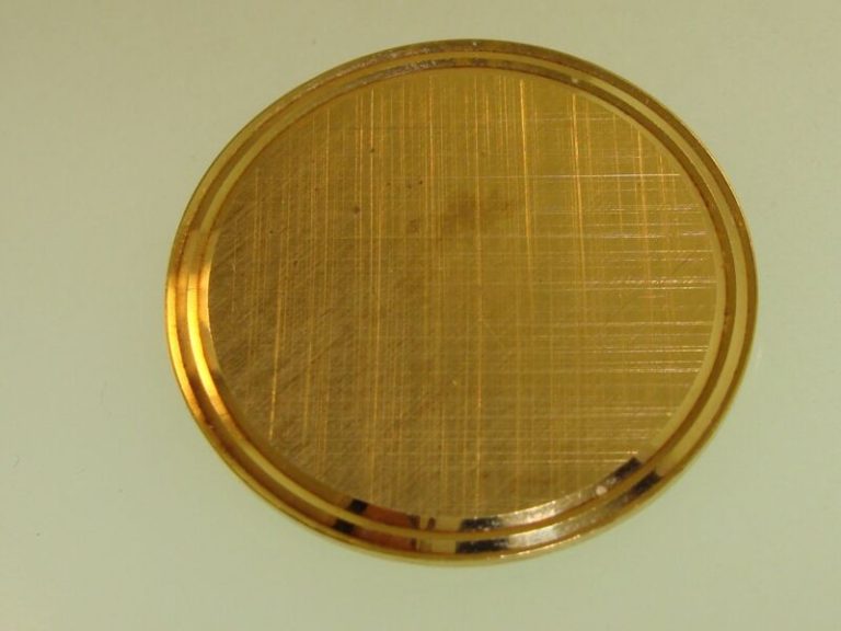 Vintage 1960s gold-tone circle pin signed by designer Lamode