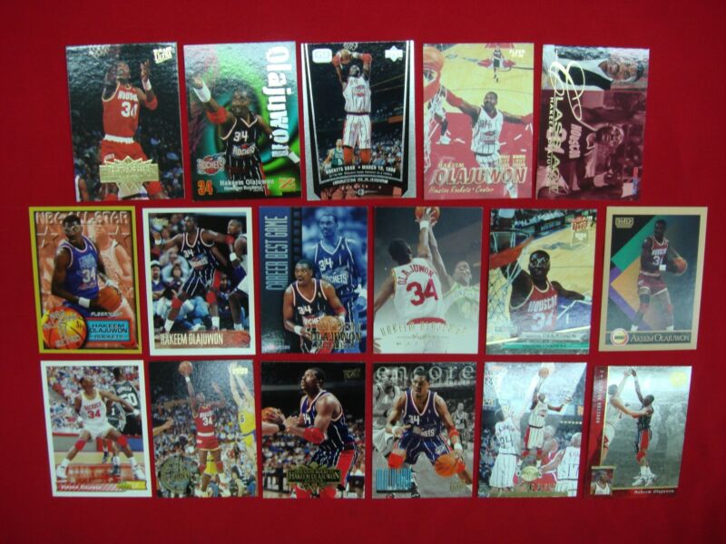 Collection of 17 premium Hakeem Olajuwon basketball cards featuring the Houston Rockets legend