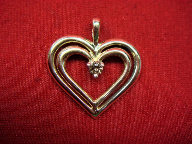 10K yellow gold double heart pendant with diamond