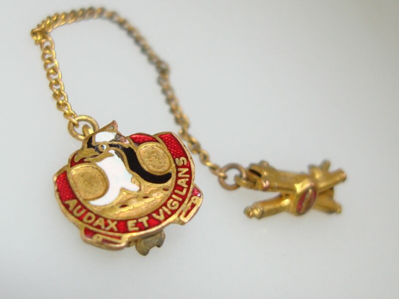 WWII Coastal Artillery enamel pin with crossed cannons and a shell, inscribed 'Audax et Vigilans'