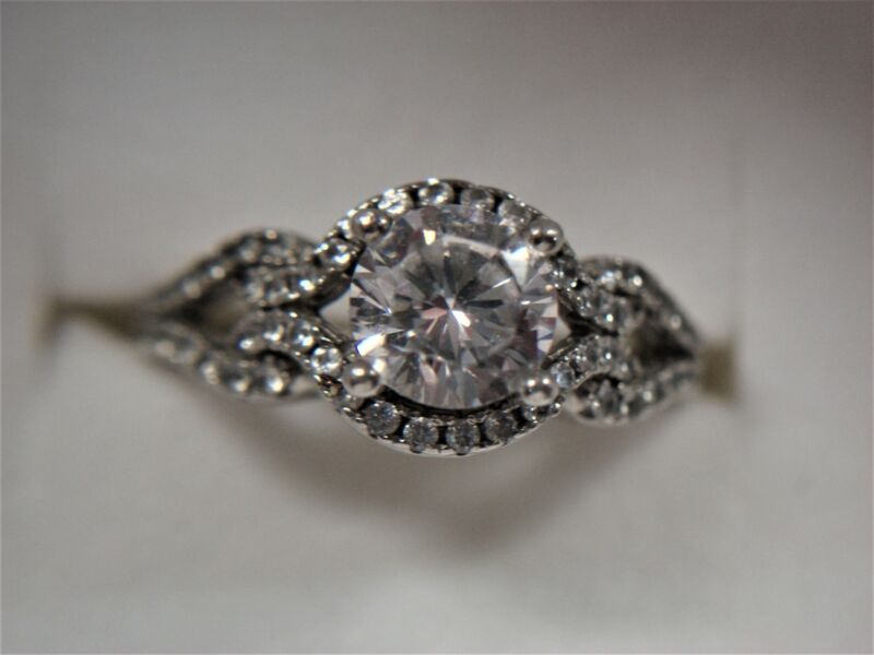 Sparkling sterling silver ring with large cubic zirconia and accent stones, size 6