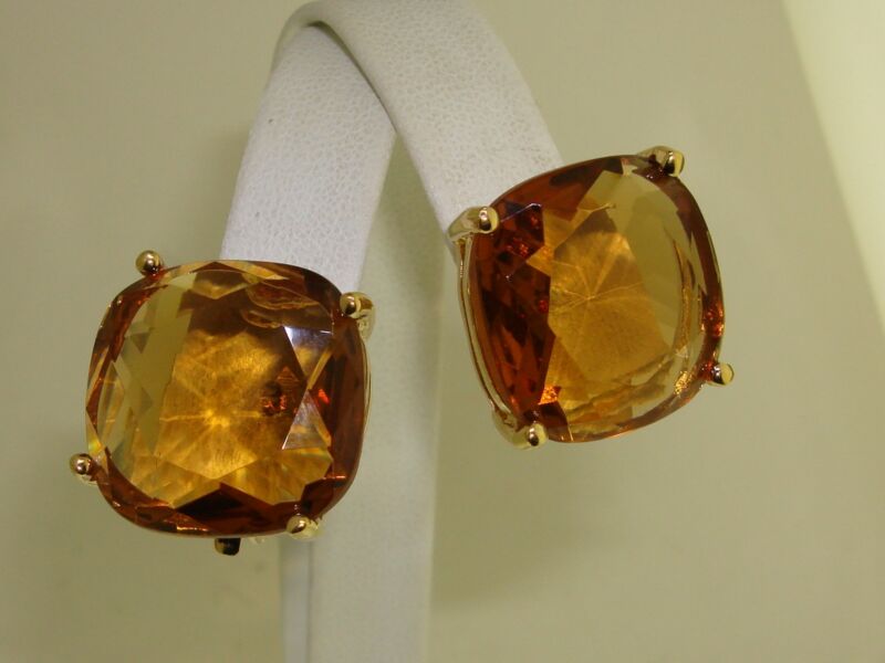 Vintage 1980s gold-tone clip-on earrings with cushion-cut faux smoky topaz stones.