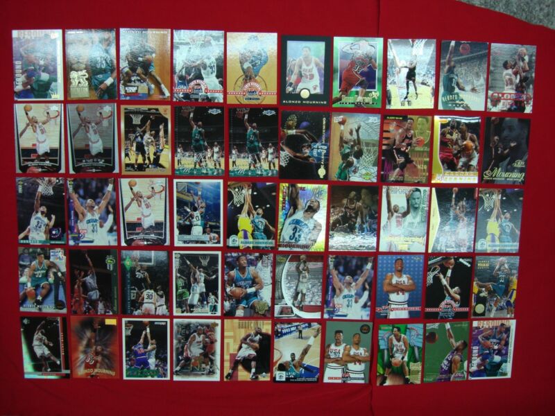 Collection of 50 Alonzo Mourning basketball cards, including rookies, premiums, parallels, and die-cuts.