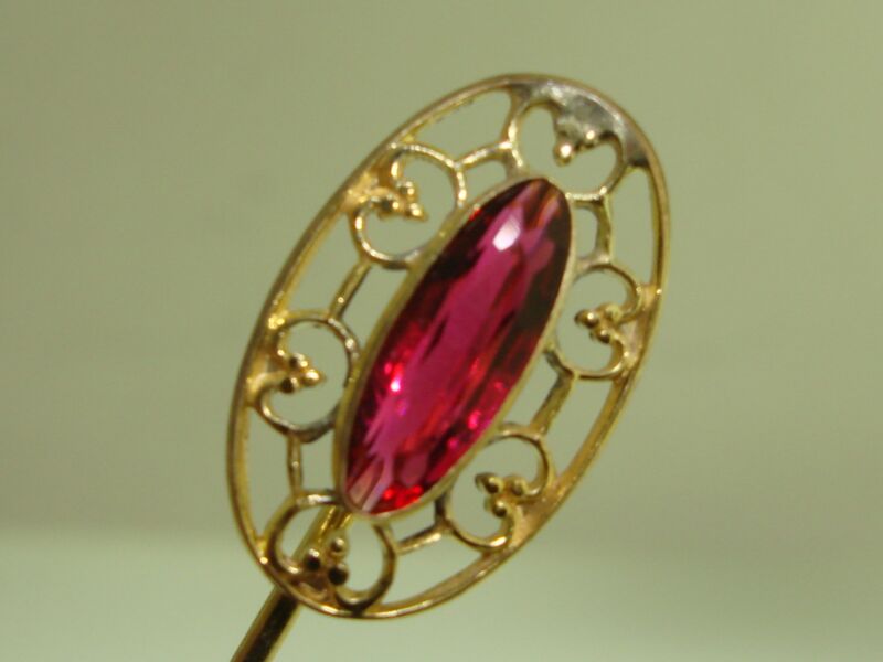 Art Nouveau pink sapphire glass stick pin with gold-washed filigree fleur-de-lis design