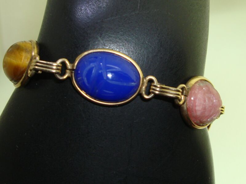 Vintage gold filled gemstone scarab bracelet with six genuine stones, including tiger's eye and lapis lazuli.