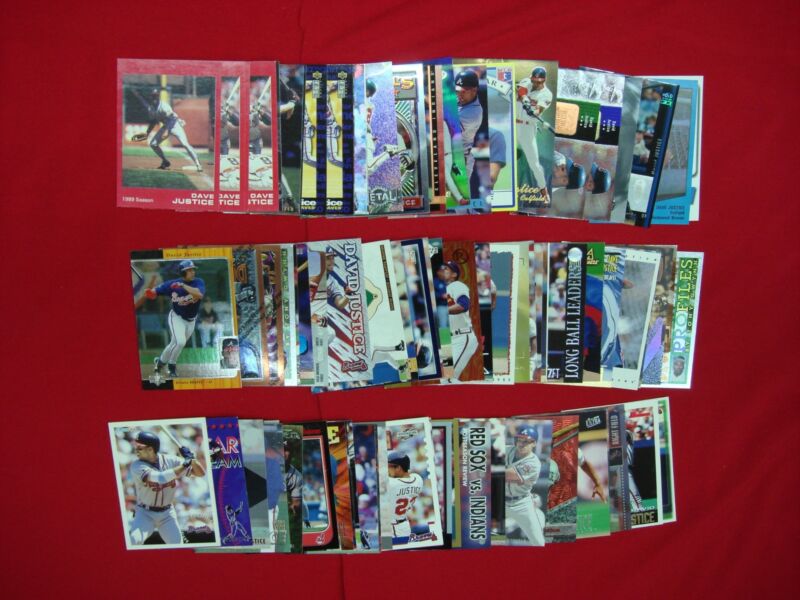 Collection of 75 David Justice baseball cards including rookies, MiLB, parallels, inserts, die-cuts, and premiums
