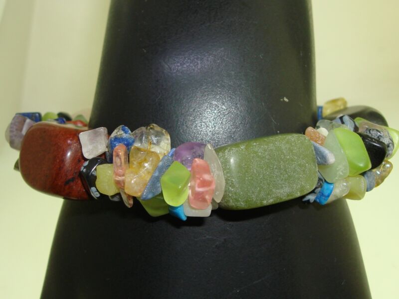 Artisan-crafted gemstone bracelet featuring quartz, chrysoprase, onyx, and nugget clusters.