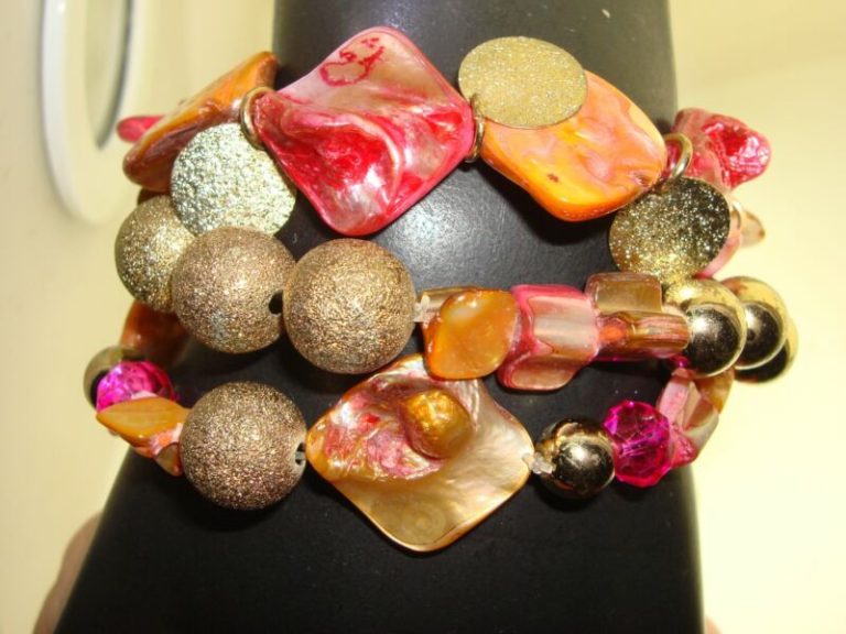 Three genuine mother-of-pearl bracelets with pink, orange, and gold lame accents
