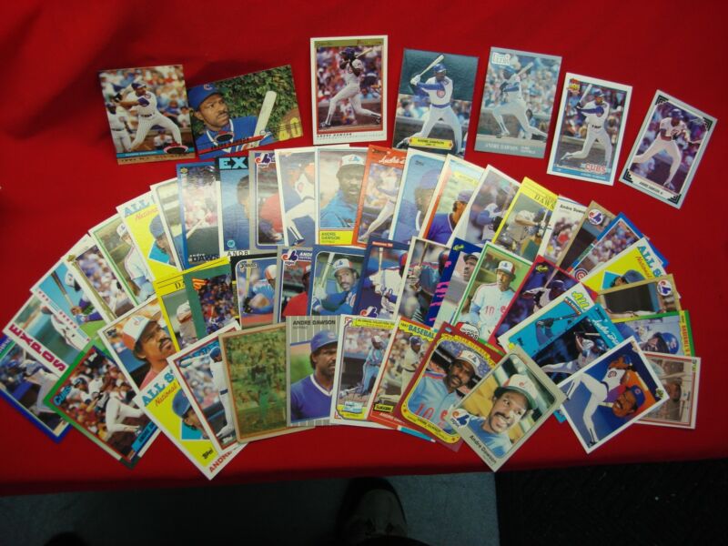 Collection of 50 unique Andre Dawson Hall of Fame baseball trading cards in various conditions.