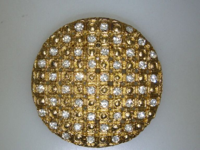 Vintage gold-tone filigree brooch with cubic zirconia accents
