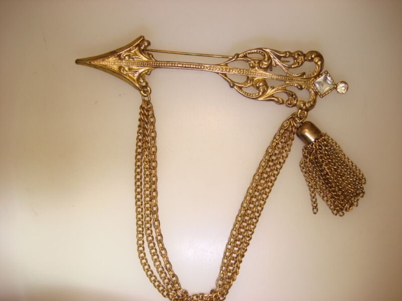 Vintage gold tone arrow bar pin with chains and tassel