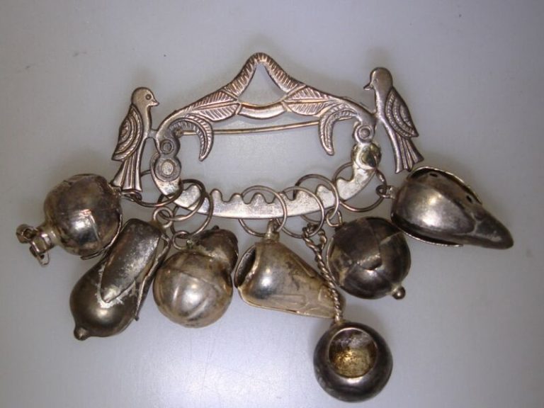 Antique Mexican silver pin with seven dangle accents