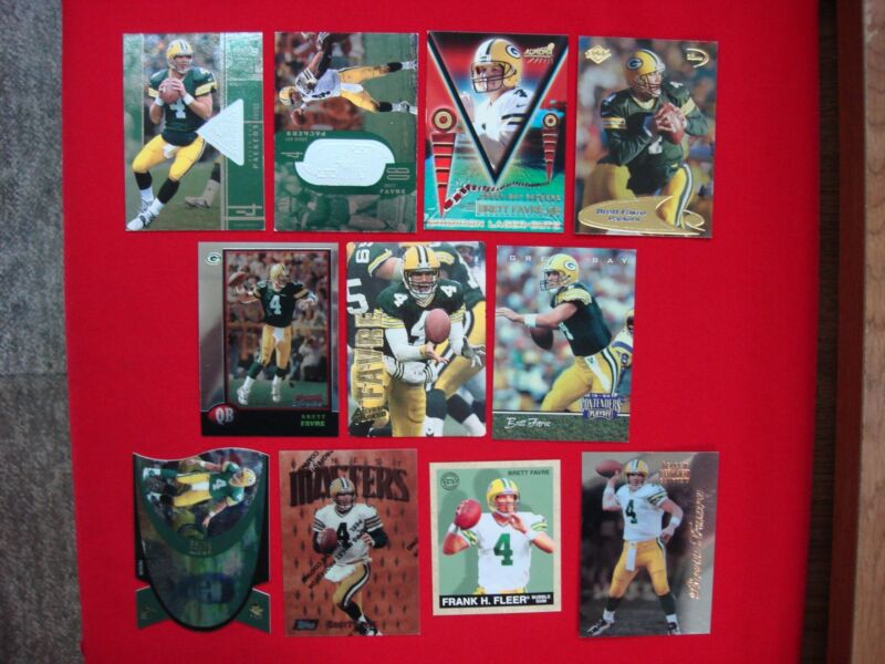 Collection of 11 Brett Favre trading cards featuring serial numbered, die-cut, foil, embossed, and hologram designs.