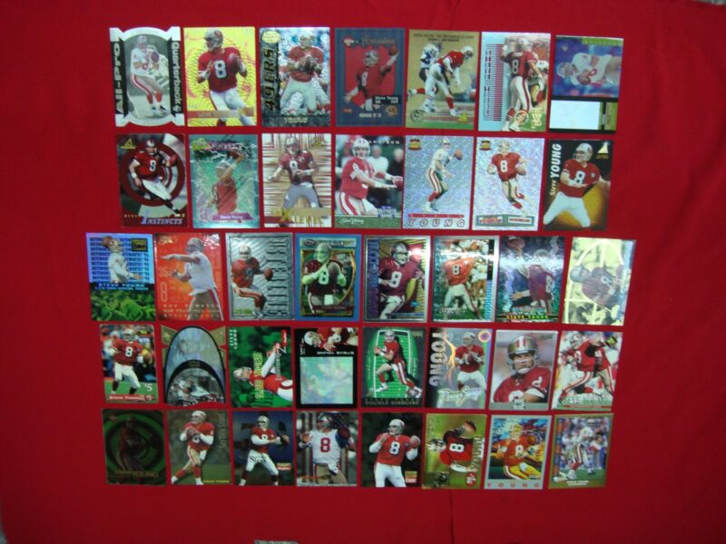Collection of 38 Steve Young football cards including serial numbered, die-cut, parallel and refractor cards.