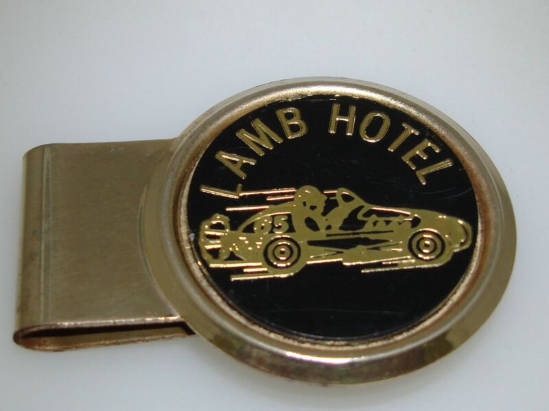 Vintage 1960s gold-tone money clip featuring a midget racer with #65, 'HIT - U.S.A.', and 'Lamb Hotel'