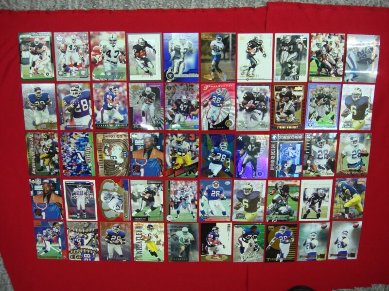 Collection of 50 Tyrone Wheatley football cards including rookies, die-cut, and inserts