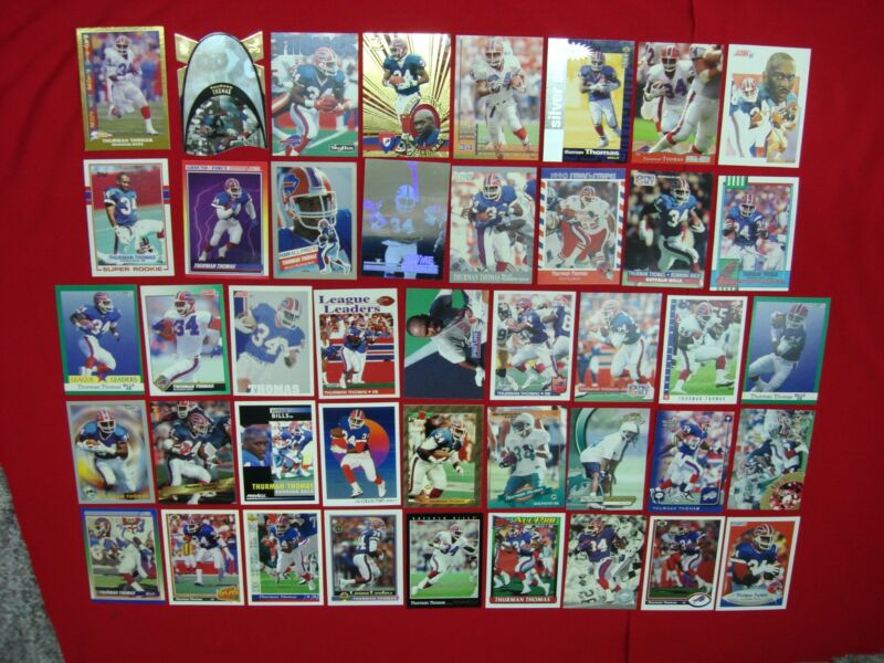 Thurman Thomas football card lot featuring early cards, parallels, die-cuts, and inserts