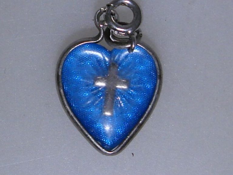 Vintage 1950s reverse-carved glass heart charm with cross, sterling silver