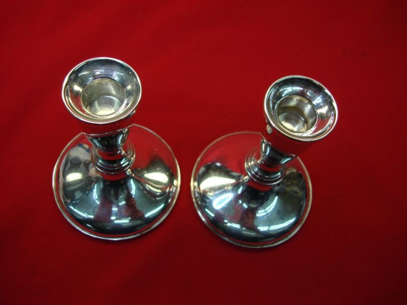 Pair of elegant Hamilton sterling silver weighted candlesticks
