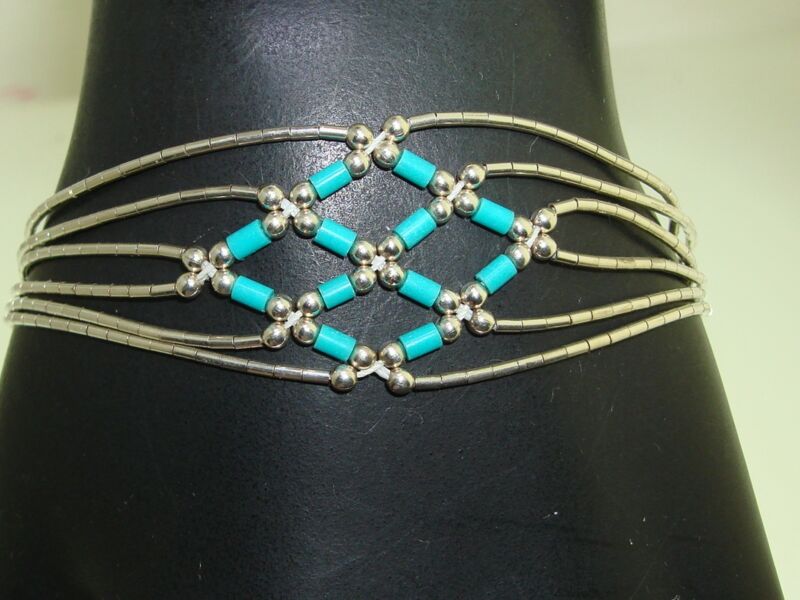 Vintage sterling silver turquoise bead bracelet with a Southwestern liquid silver design