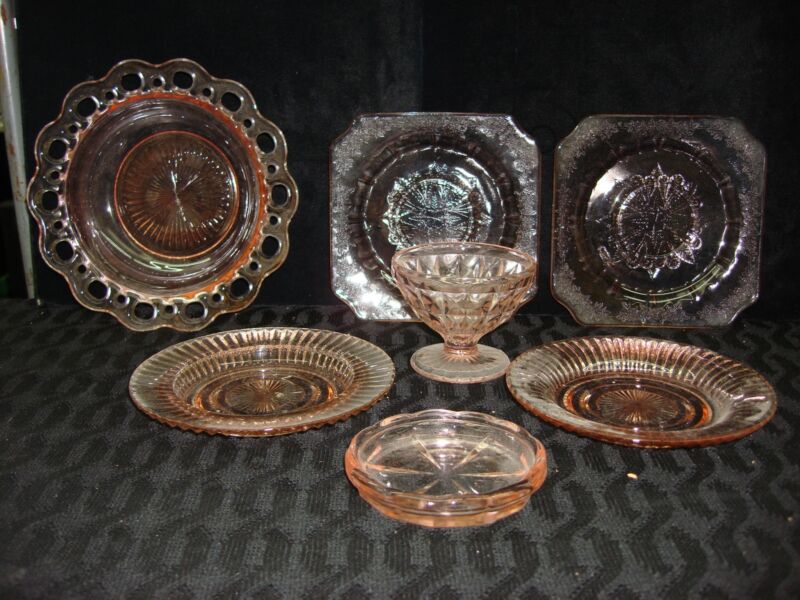 Vintage pink Depression glass set including bowls, saucers and more