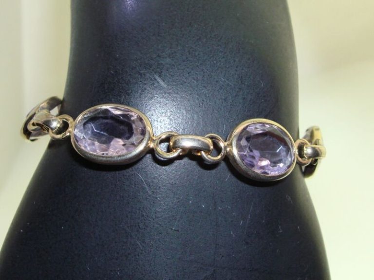 Vintage 1960s gold-tone amethyst glass bracelet with bezel set stones.
