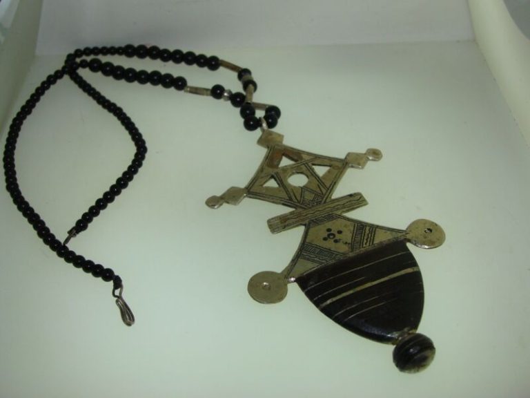 Vintage Tuareg cross pendant necklace crafted from silver and leather