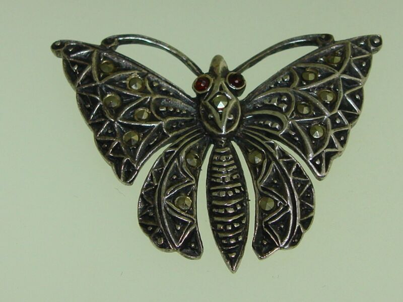 Vintage sterling silver butterfly brooch with marcasite and garnet
