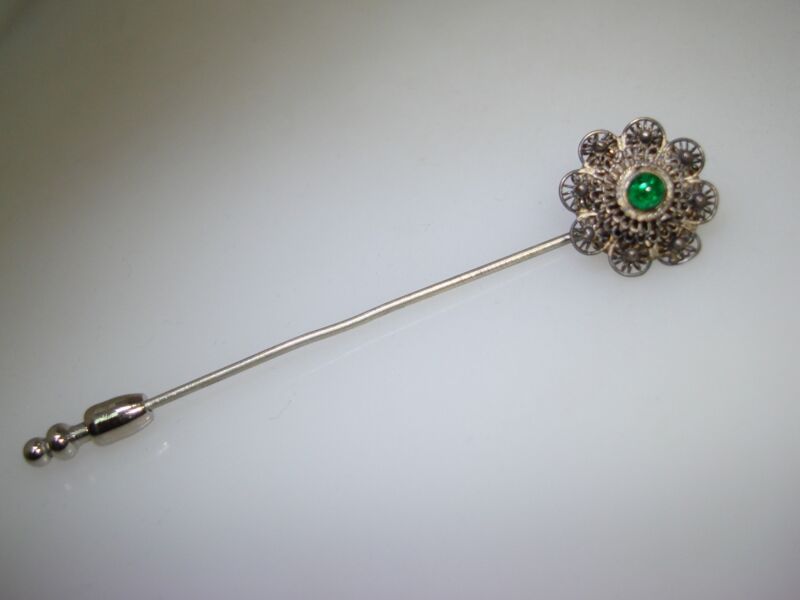 Antique sterling silver filigree stick pin with green enamel