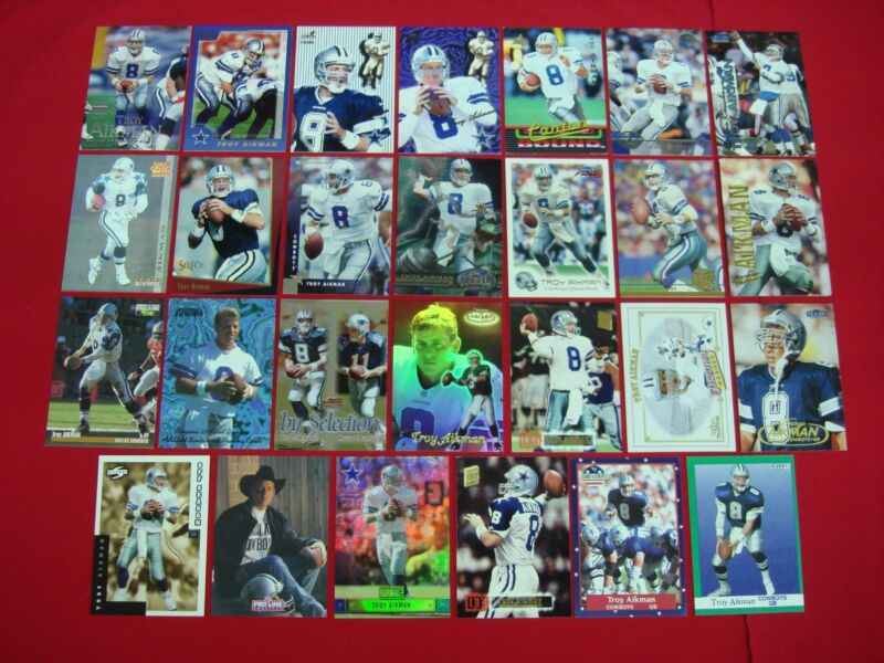 Collection of 27 Troy Aikman football cards, including premiums, inserts, and foils.