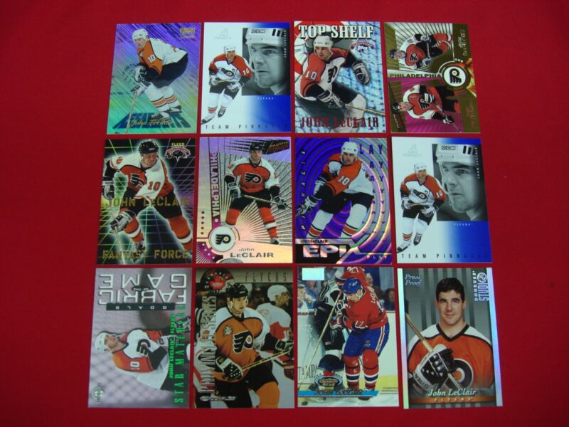 John LeClair hockey card collection featuring rare serial numbered cards, a press proof and a first day issue