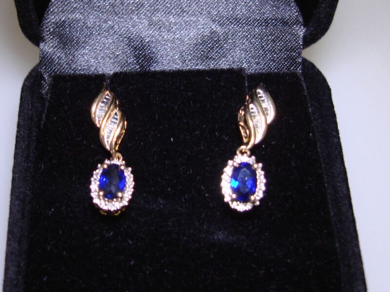 Sterling silver blue topaz and diamond dangle earrings