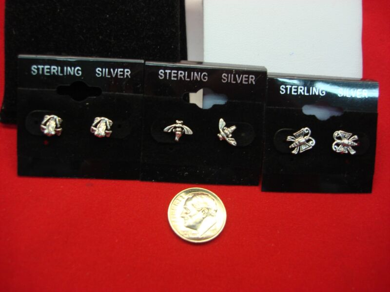 Sterling silver stud earrings in a set of three, featuring frog, bee, and butterfly designs.