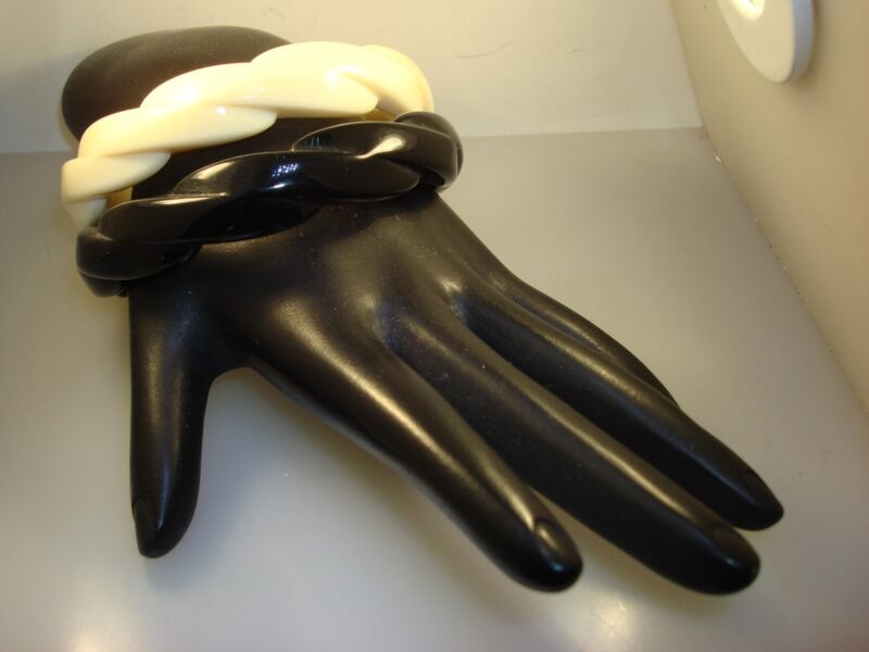 Pair of vintage 1970s Lucite bangle bracelets, black and white twisted design