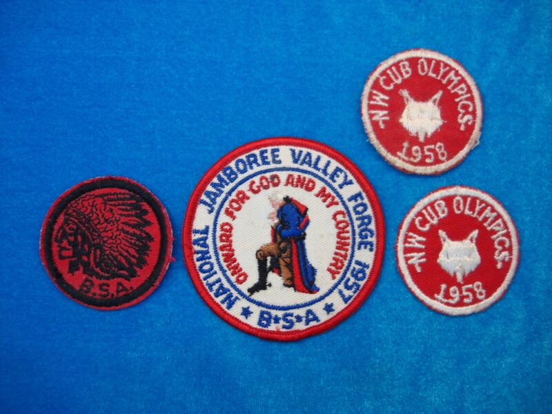 Vintage Boy Scout and Cub Scout patches from the 1957 Jamboree, Cub Olympics, and featuring a Native American chief.