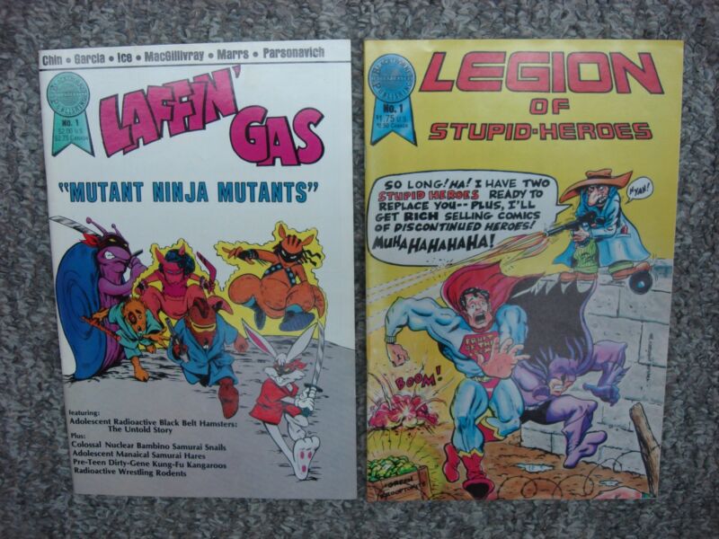 Laffin' Gas #1 and Legion of Stupid-Heroes #1 comic books in excellent condition.