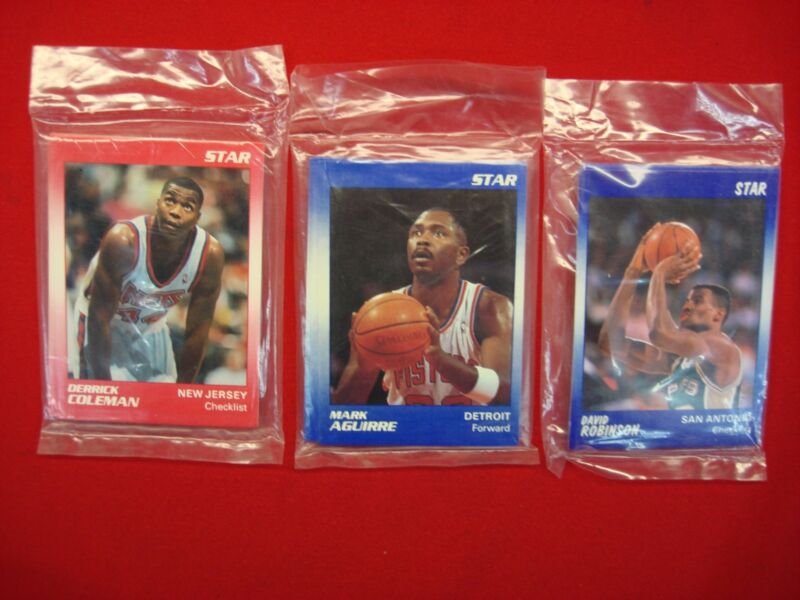 Vintage sealed STAR CO basketball player trading card sets from the 1990s, featuring Mark Aguirre, Derrick Coleman, and David Robinson.