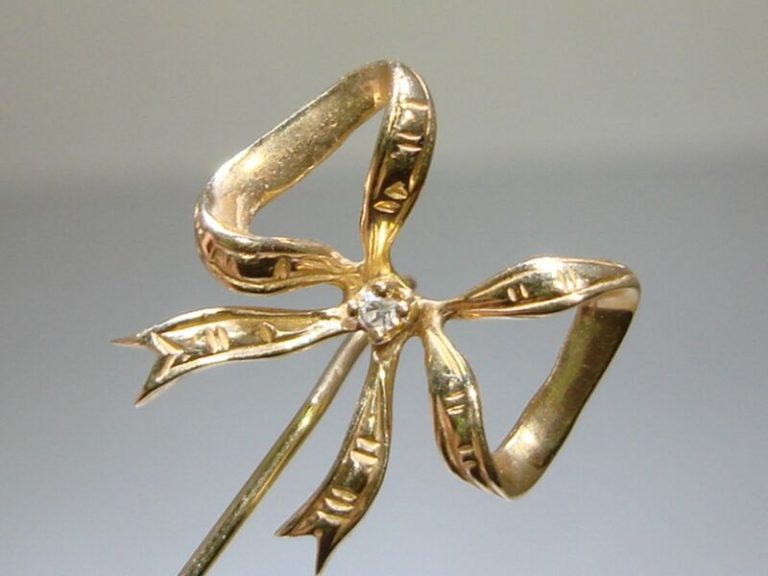 Vintage 14K gold ribbon bow stick pin with diamond accent