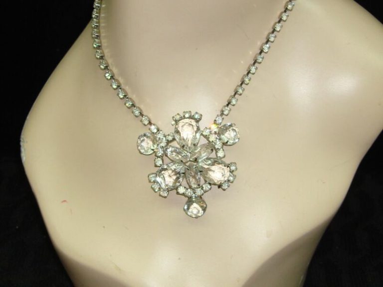 1960s vintage rhinestone choker necklace with a large centerpiece of round, pear-shaped, and marquise-cut rhinestones.