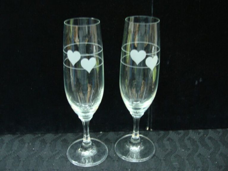 Vintage German crystal champagne flutes with etched hearts