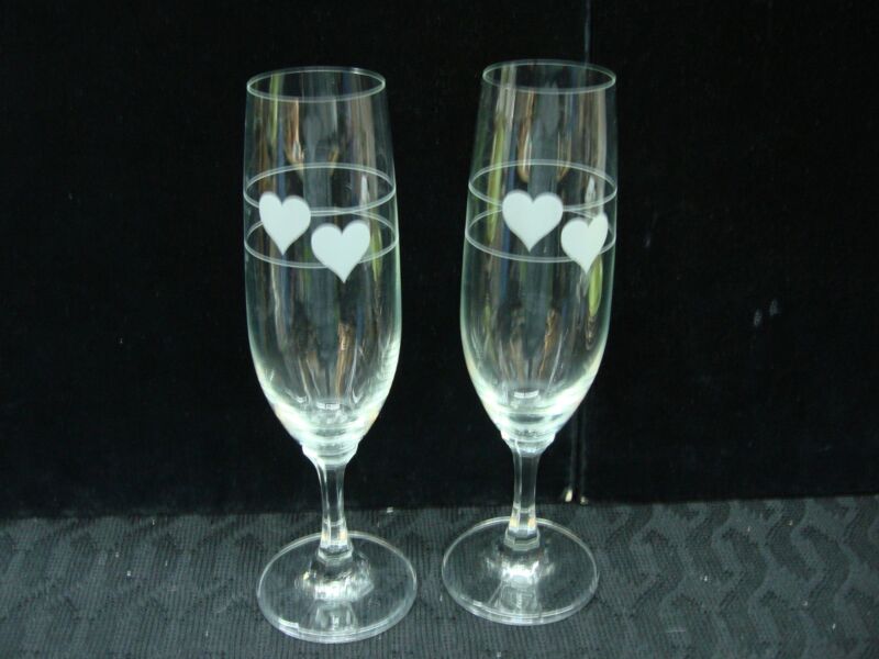 Vintage German crystal champagne flutes with etched hearts